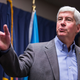 : Michigan Gov. Rick Snyder speaks to the media regarding the status of the Flint water crisis on January 27, 2016, at Flint City Hall in Flint, Michigan.